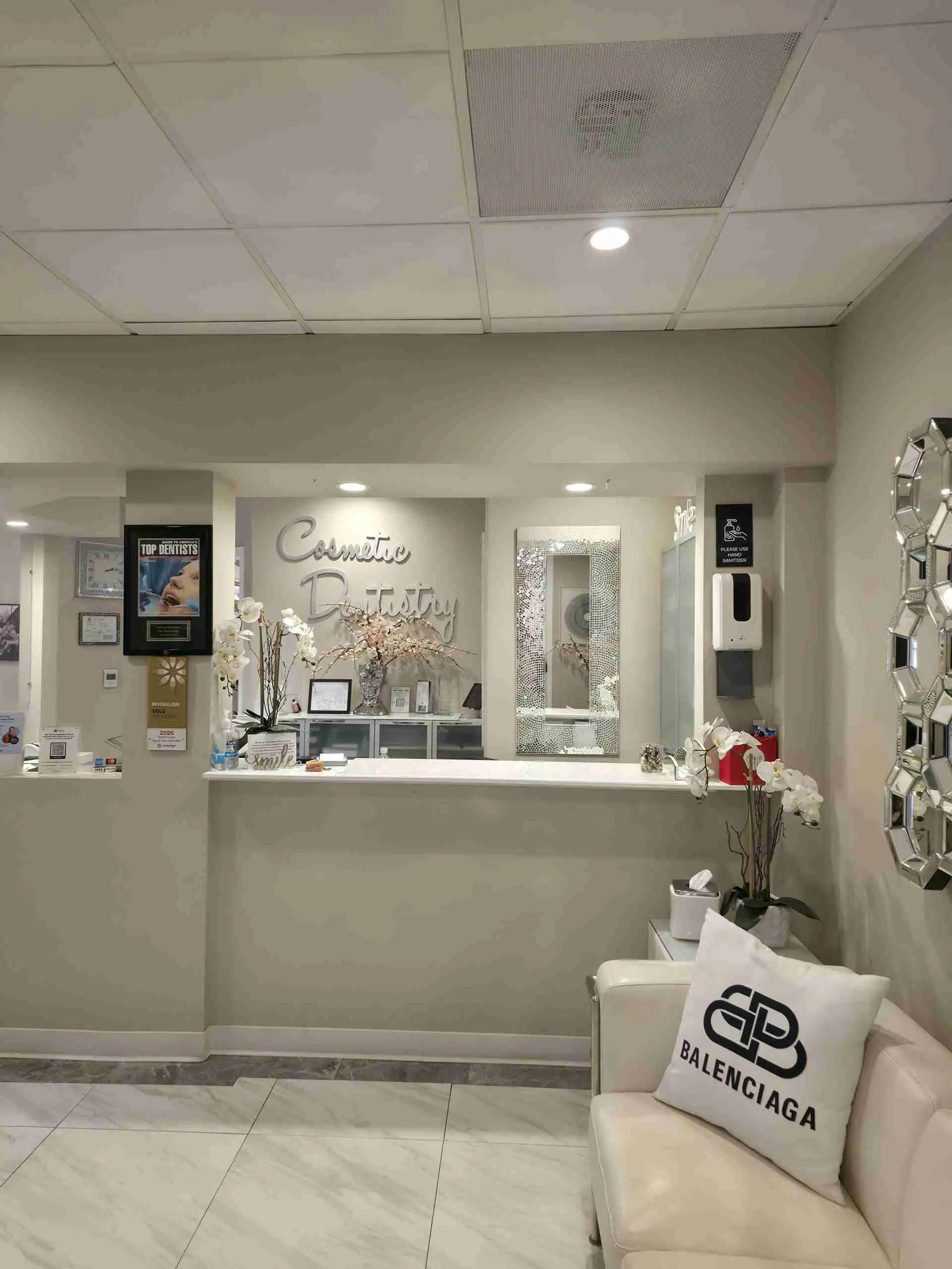 Reception desk and waiting area with the Cosmetic Dentistry sign